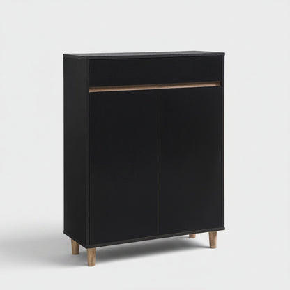 A modern black two-door cabinet with a top drawer, a thin light wood accent bar, and tapered light wood legs, shown on a plain white background.