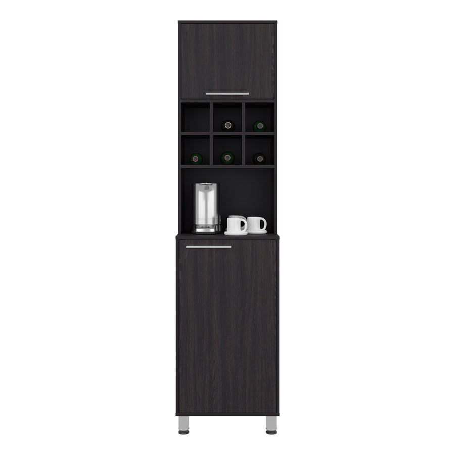A tall, narrow dark wood beverage bar cabinet with a top storage compartment, open shelving with wine bottle holders, a countertop with a glass and two white mugs, and a lower cabinet door, shown on a plain white background. Wenge
