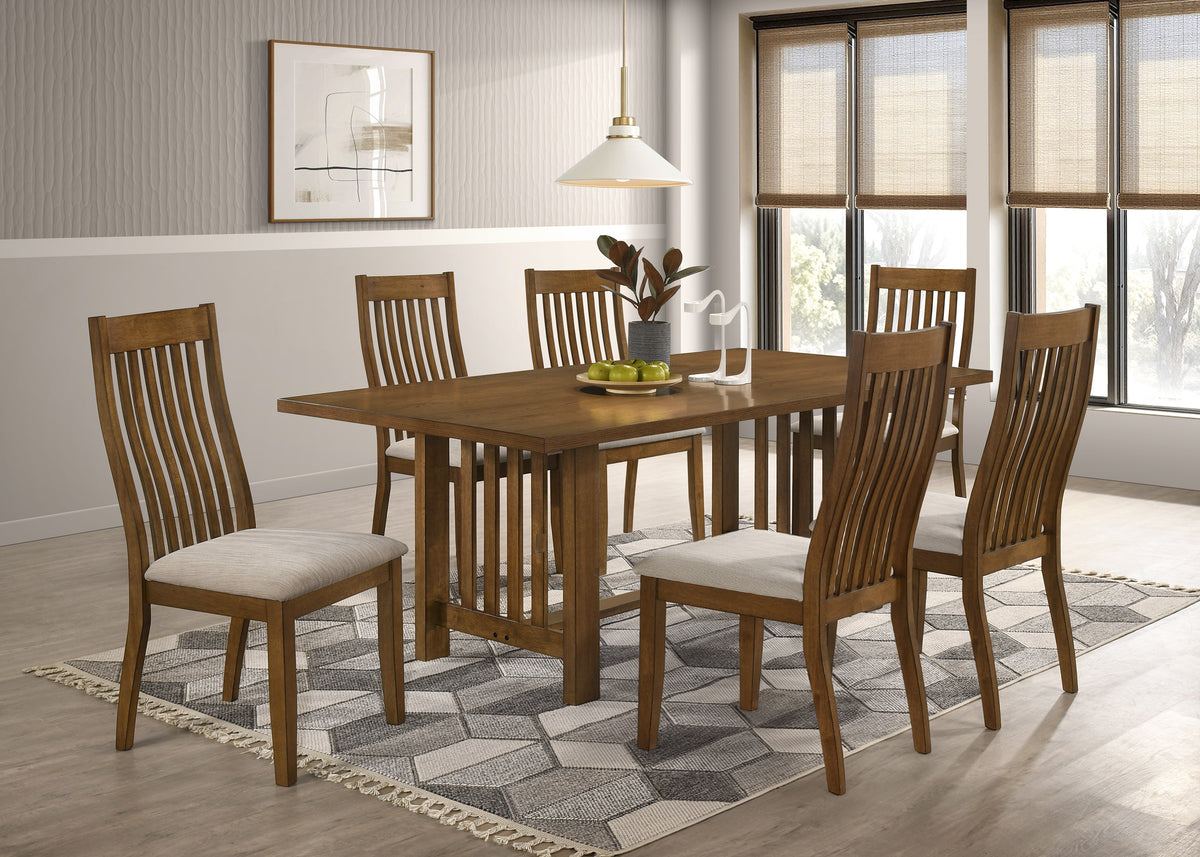 6 Seater (7pcs) A 7-piece wooden dining room set including a rectangular table and six slatted-back chairs with cream upholstered seats, shown in a bright dining room setting.