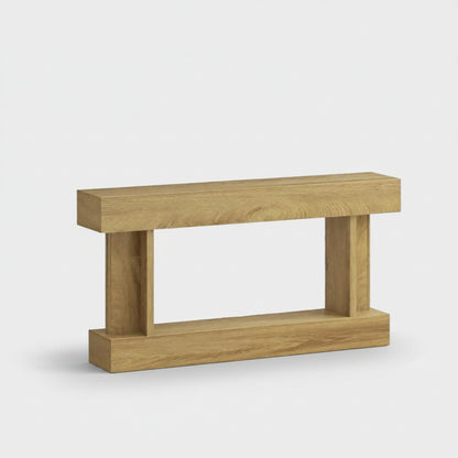 A modern wooden console table with a natural oak finish, featuring a thick rectangular top, two vertical support posts, and a lower shelf, shown against a plain light gray background.