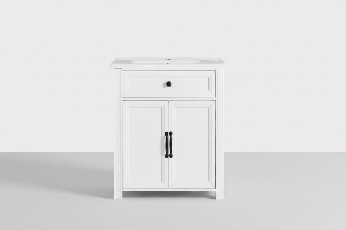 A white single-sink bathroom vanity cabinet with a single drawer and two cabinet doors, featuring black hardware, shown against a plain white background.
