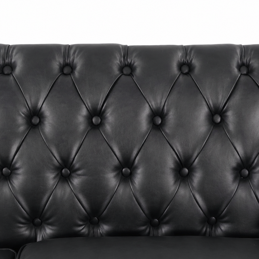 Close-up of a black tufted leather or faux-leather sofa backrest with diamond button tufting and a clean white background. black  3 Seater solo loveseat