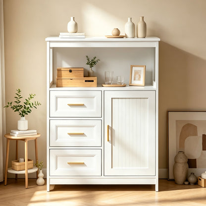 A white wooden storage cabinet with three drawers, a single door, and open shelving, styled in a warm beige room with decorative vases, books, and small plants.