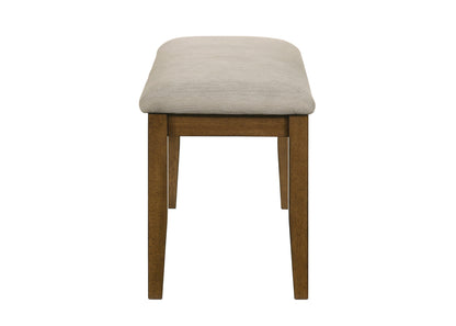 Stool with beige cushioned seat and wooden legs on a white background