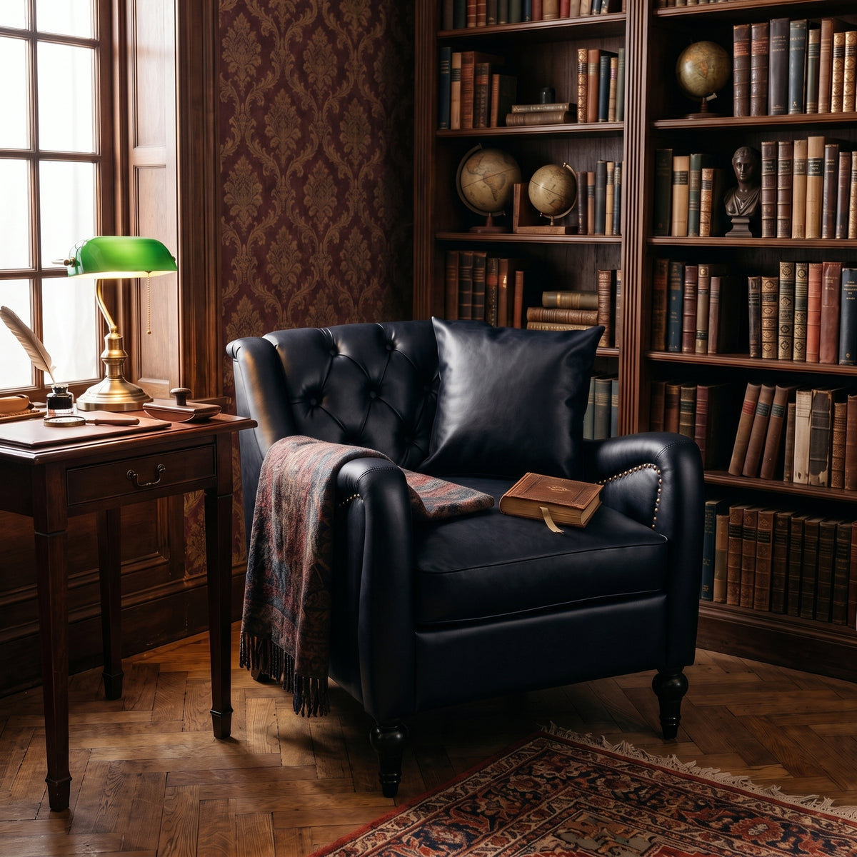 black  Solo leather armchair in a vintage library setting, featuring a tufted back, nailhead trim, a matching throw pillow, a patterned fringed throw blanket, and a book resting on the seat.