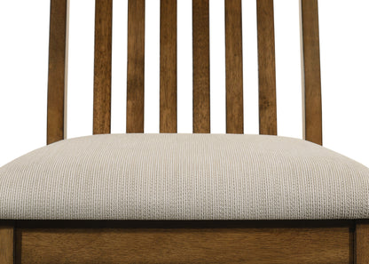 Wooden chair with a beige cushion on a white background
