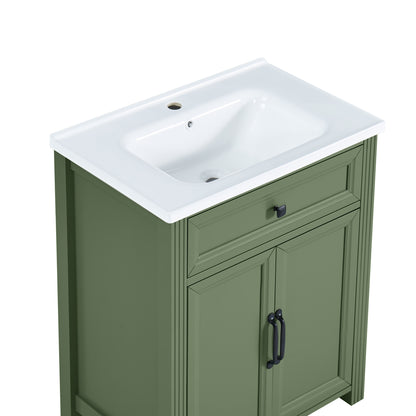 Olive green bathroom vanity cabinet with a integrated sink countertop, featuring a single drawer and two cabinet doors with dark metal handles.