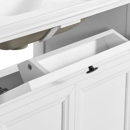 Close-up of a white bathroom vanity cabinet drawer with a black knob, showing the interior storage space and hardware.