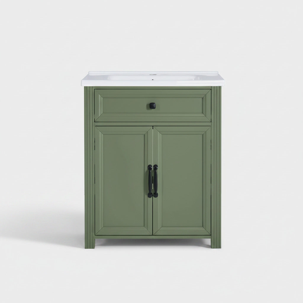 Olive green bathroom vanity cabinet with a ceramic sink basin, featuring a single drawer and two cabinet doors with black hardware, shown against a plain background.