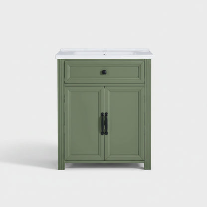 Olive green bathroom vanity cabinet with a ceramic sink basin, featuring a single drawer and two cabinet doors with black hardware, shown against a plain background.