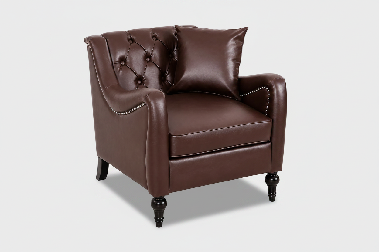 A classic Chesterfield-style armchair upholstered in dark brown faux leather, featuring a tufted button backrest, rolled arms with nailhead trim, and dark turned legs, shown with a matching throw pillow on a white background. Dark Brown solo

