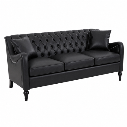 A black faux leather Chesterfield loveseat sofa with button tufting on the backrest, two matching throw pillows, and turned black legs, shown against a plain white background. black  3 Seater