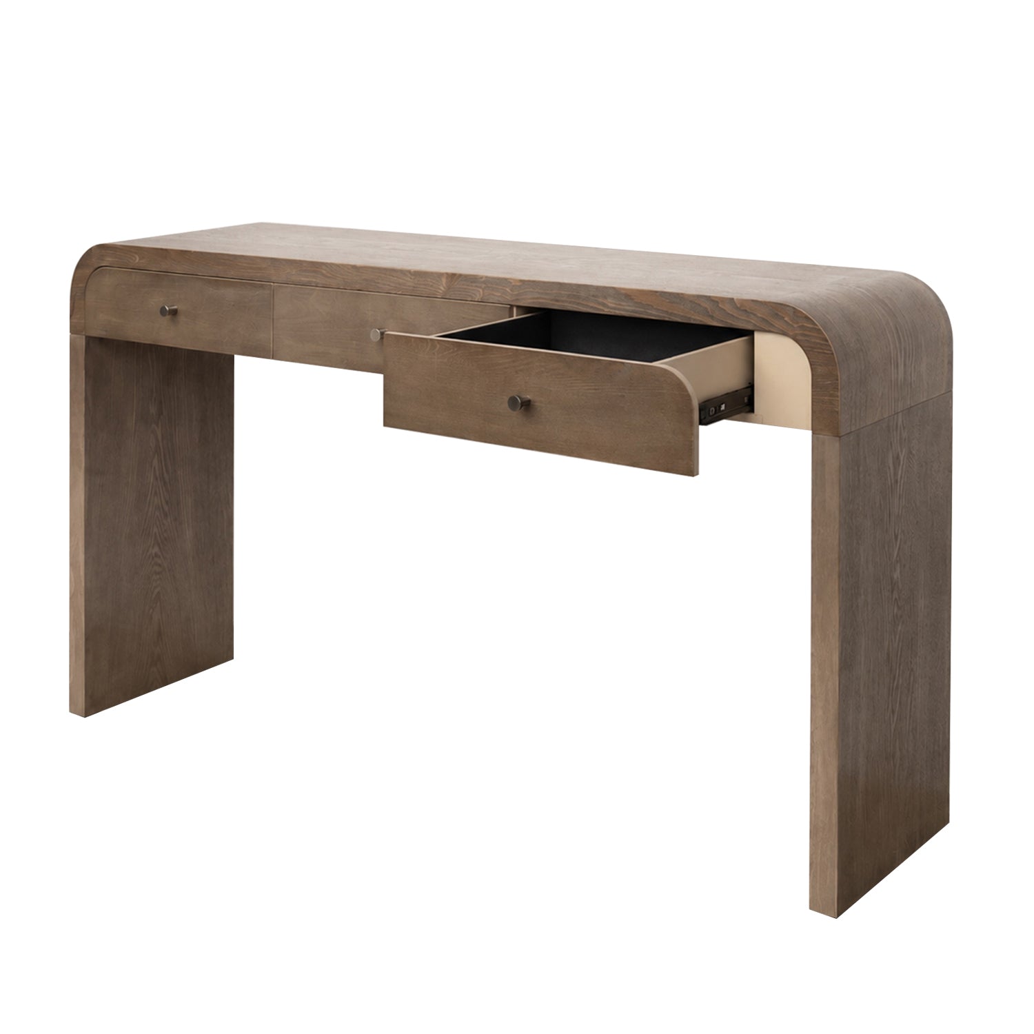 A modern wooden console desk with a curved top and legs, featuring a medium brown wood finish and an open drawer showing a black interior, set against a plain white background.