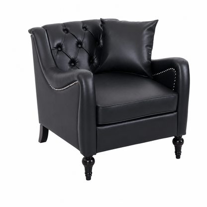 A black  Solo faux leather wingback armchair with button tufting on the backrest, nailhead trim on the arms, and turned black legs, shown with a matching back cushion on a white background.