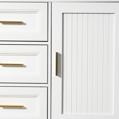 Close-up of a white cabinet with a vertical beadboard door panel and a slim vertical gold handle, next to white drawers with horizontal gold handles.