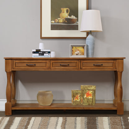 Wooden console table with decorative items against a wall with a framed picture.