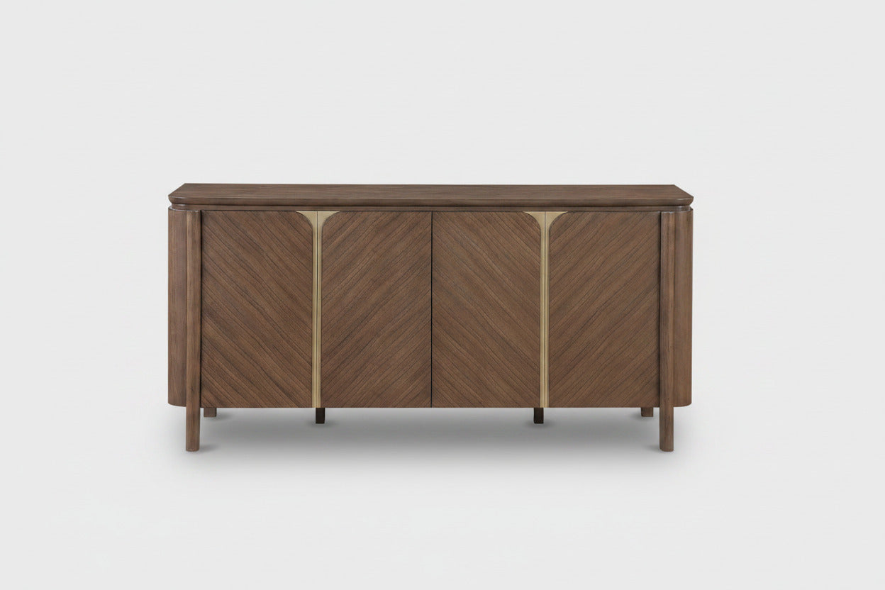 A mid-century modern wooden sideboard with three doors featuring a chevron wood grain pattern and polished brass vertical accents, shown against a plain white background.