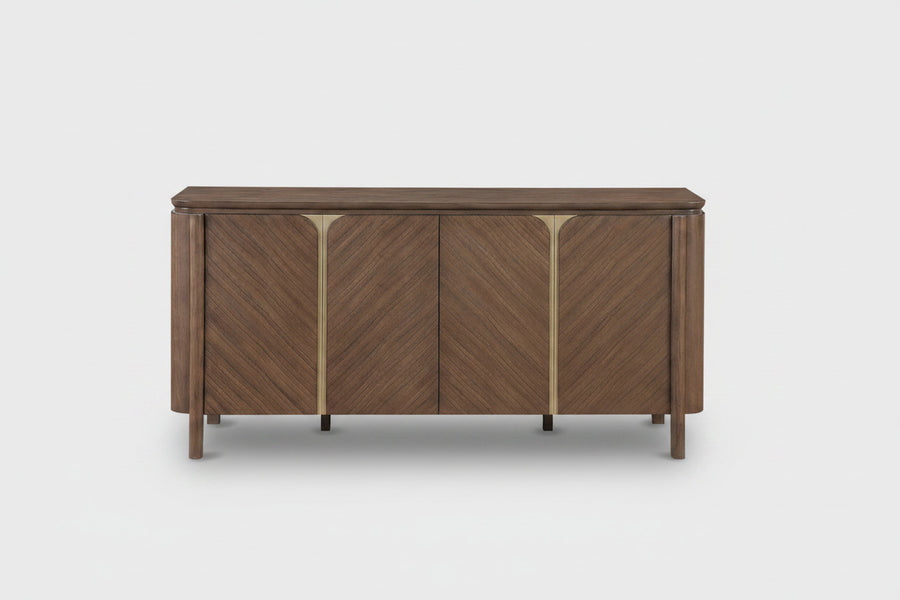 A mid-century modern wooden sideboard with three doors featuring a chevron wood grain pattern and polished brass vertical accents, shown against a plain white background.